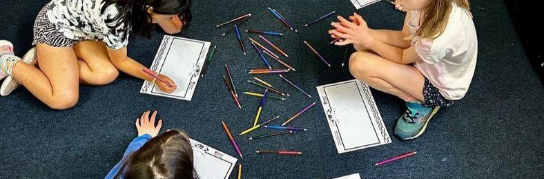 Kids colouring at panto camp