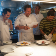Chefs standing in kitchen