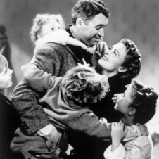 Man & Woman hugging children