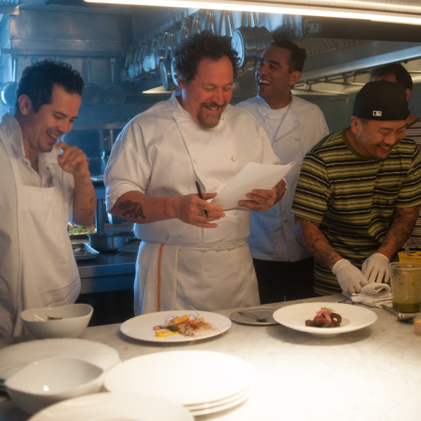 Chefs standing in kitchen